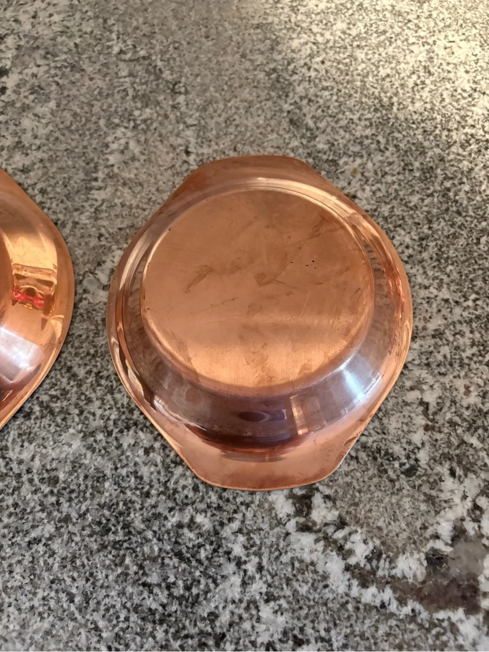 Set of two copper coated oval bowls